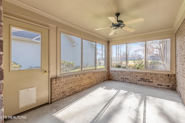 unfurnished sunroom featuring ceiling fan