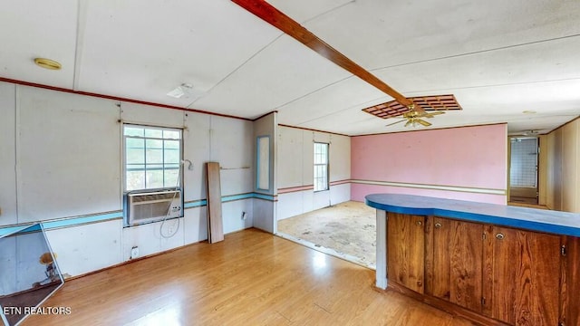 bar featuring crown molding, plenty of natural light, ceiling fan, and light hardwood / wood-style flooring