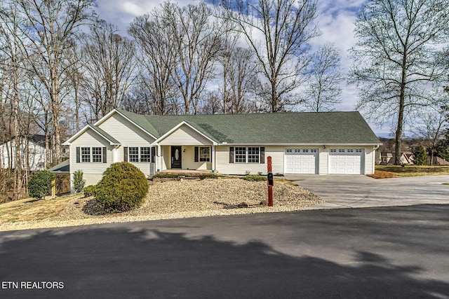 view of front of property featuring a garage and covered porch