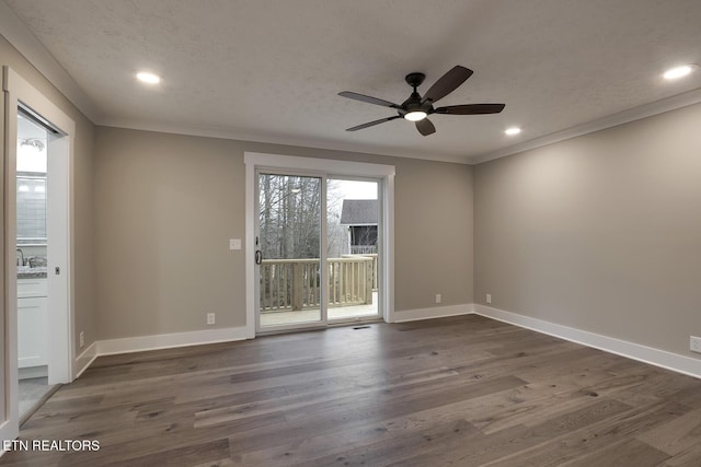 empty room with ornamental molding, dark hardwood / wood-style floors, ceiling fan, and a textured ceiling