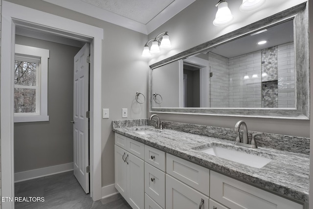 bathroom with vanity and a textured ceiling