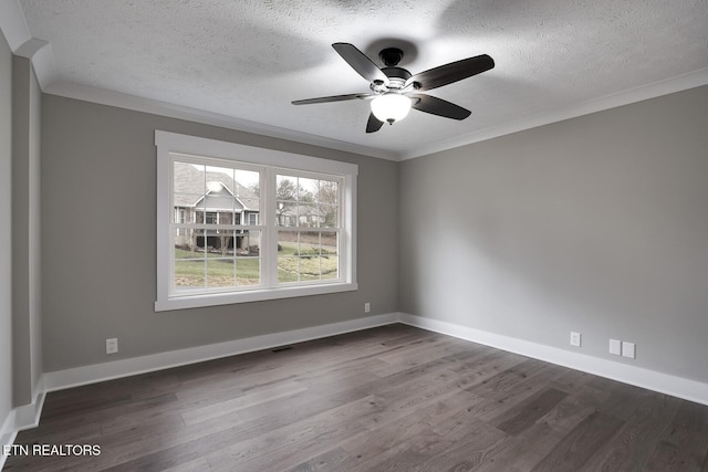 empty room with crown molding, dark hardwood / wood-style floors, ceiling fan, and a textured ceiling