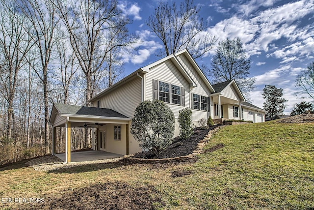 exterior space featuring ceiling fan, a patio area, and a front yard