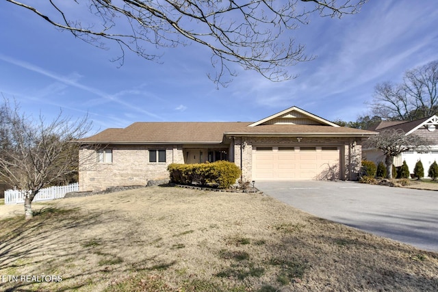 ranch-style house featuring a garage