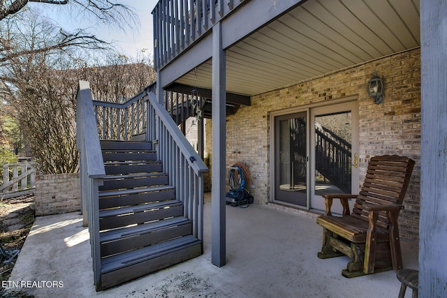 view of patio featuring a balcony