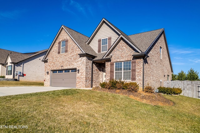 view of front of property with a garage and a front yard