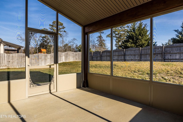 unfurnished sunroom with a wealth of natural light