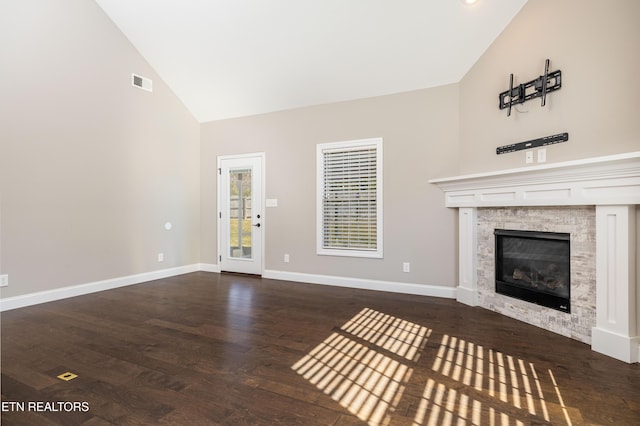 unfurnished living room featuring dark hardwood / wood-style flooring and high vaulted ceiling