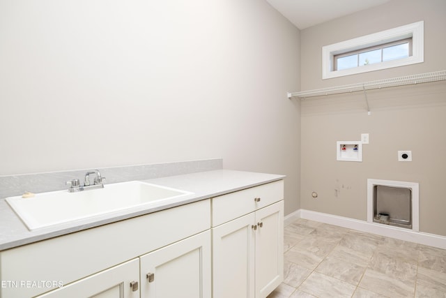 laundry room with cabinets, electric dryer hookup, sink, and hookup for a washing machine