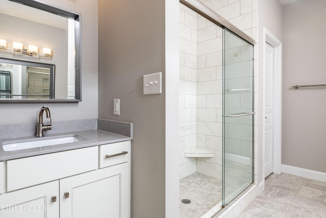 bathroom featuring vanity and an enclosed shower