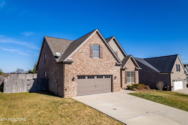 front facade with a garage and a front yard