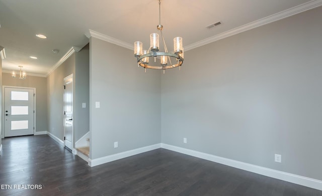 unfurnished room with an inviting chandelier, ornamental molding, and dark hardwood / wood-style floors