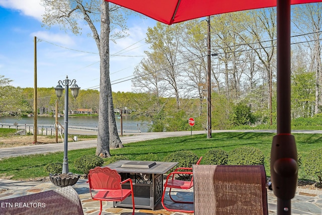 view of patio featuring a water view