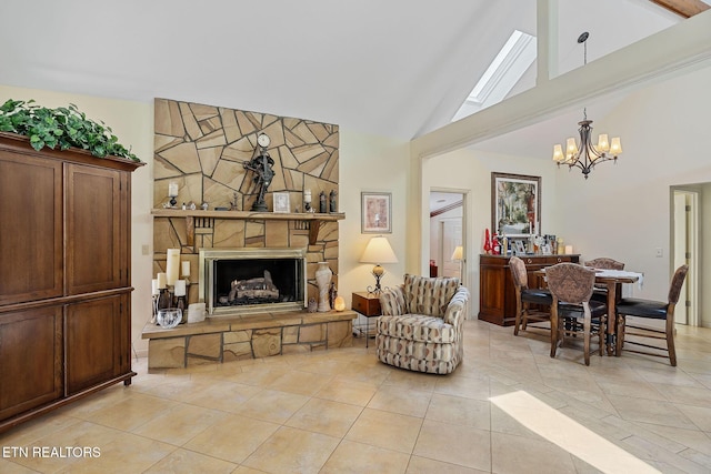 living area featuring a chandelier, a stone fireplace, high vaulted ceiling, and light tile patterned floors