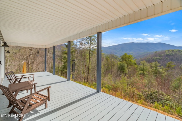 wooden terrace featuring a mountain view