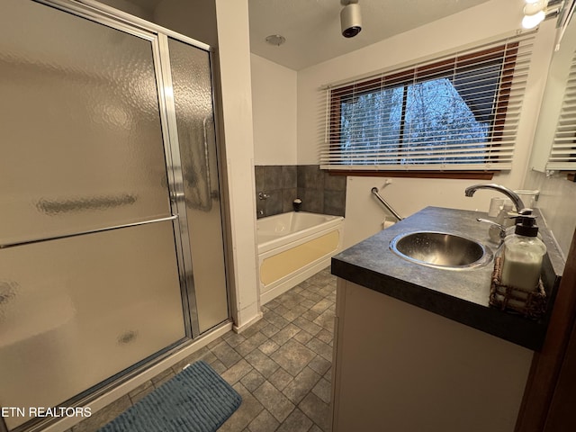 bathroom featuring vanity and separate shower and tub