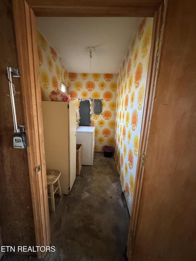 bathroom with washer / clothes dryer and concrete flooring