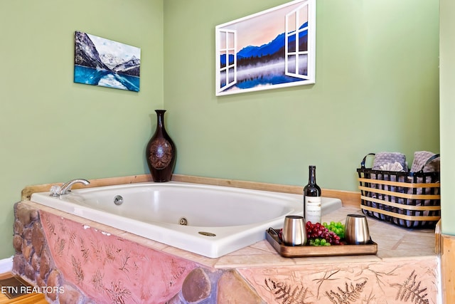 bathroom featuring tiled bath