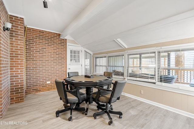 sunroom with lofted ceiling with beams