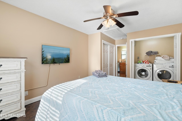 bedroom with ceiling fan, washer and dryer, and dark hardwood / wood-style floors