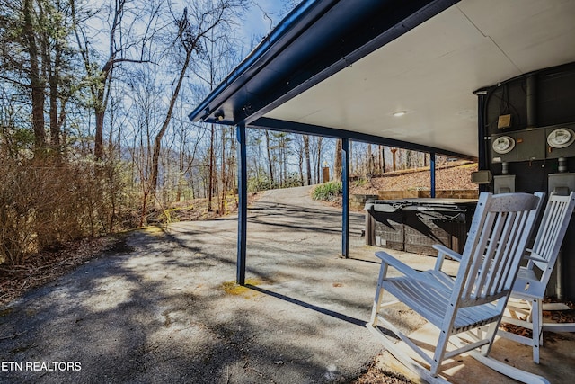 view of patio with a hot tub