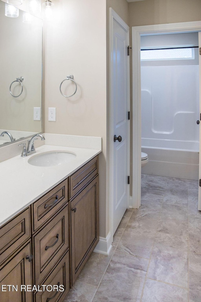 bathroom with toilet, shower / bath combination, and vanity