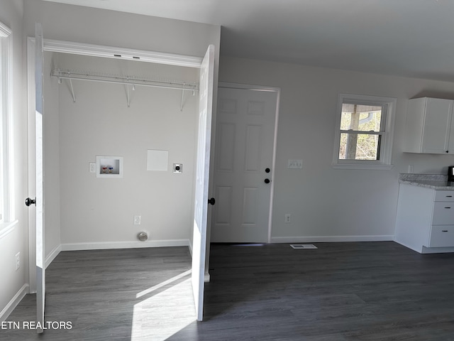 laundry room featuring electric dryer hookup, dark wood-type flooring, and washer hookup