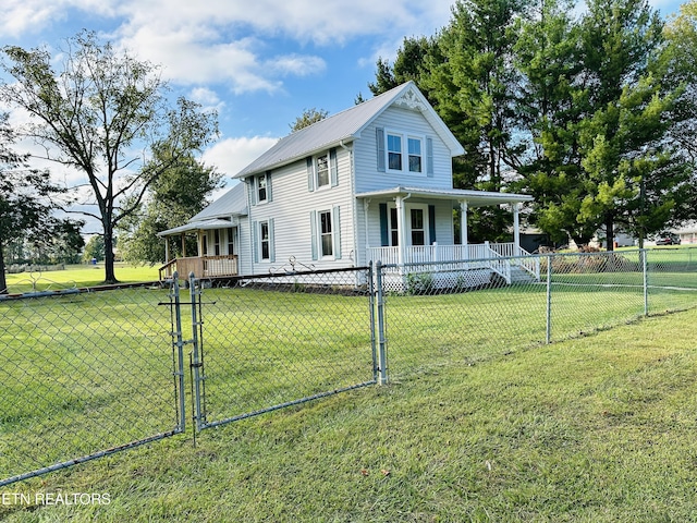 farmhouse inspired home featuring a porch and a front yard