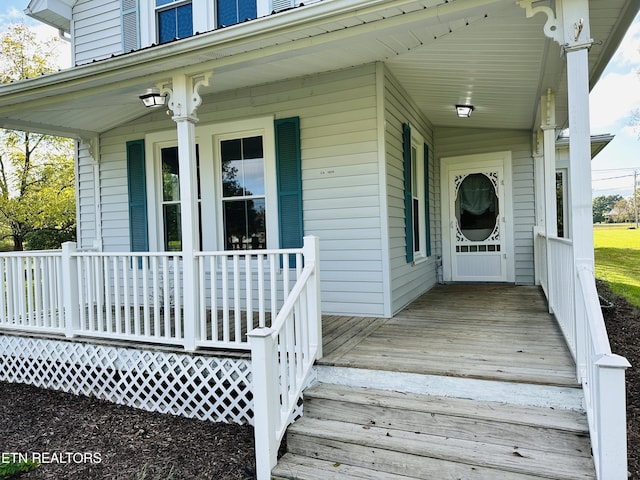 doorway to property featuring a porch