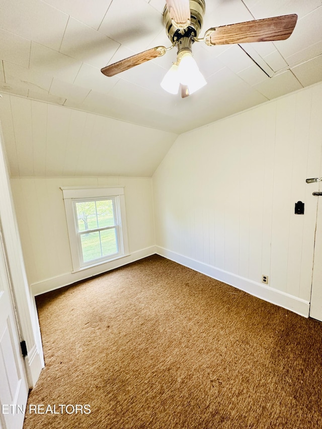 additional living space with vaulted ceiling, carpet floors, and ceiling fan