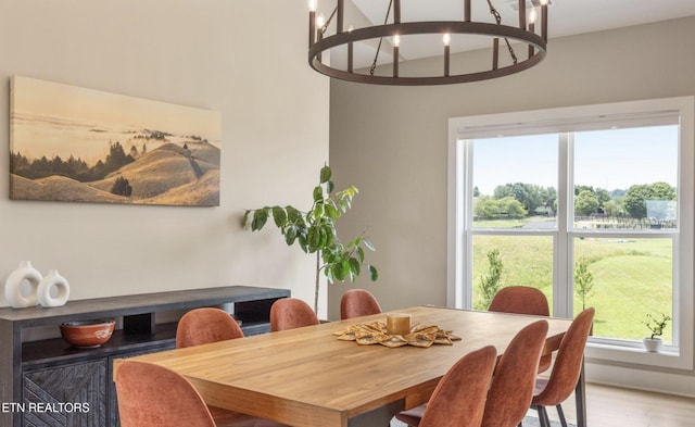 dining space featuring plenty of natural light and a chandelier