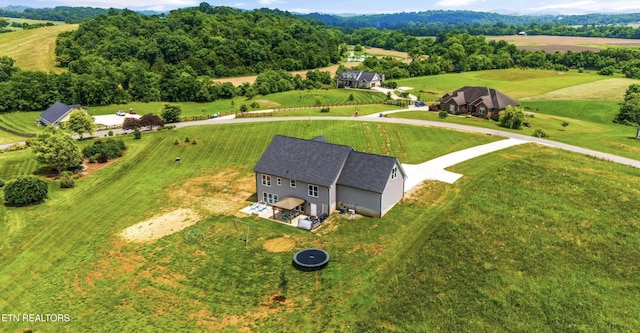 birds eye view of property featuring a rural view