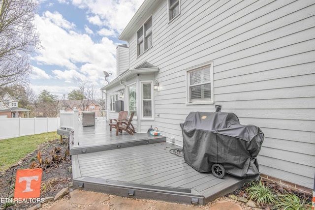 wooden deck featuring grilling area