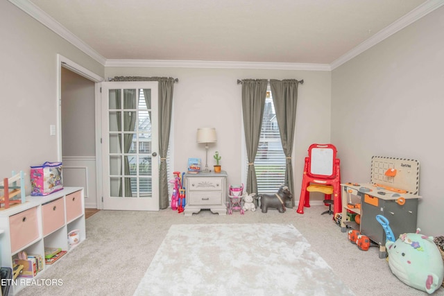 playroom featuring ornamental molding and carpet flooring