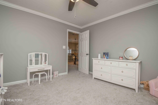 interior space with light carpet, ornamental molding, and ceiling fan