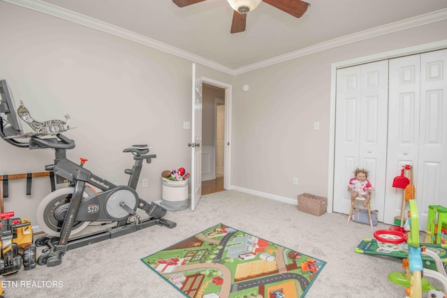 game room featuring ornamental molding, ceiling fan, and carpet flooring