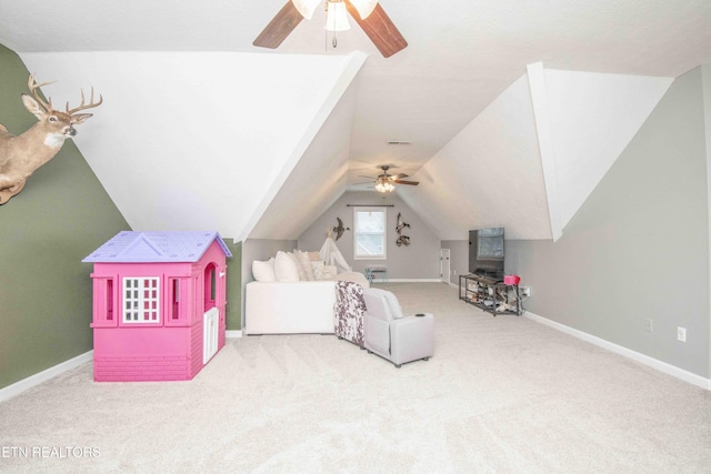 carpeted bedroom with vaulted ceiling and ceiling fan