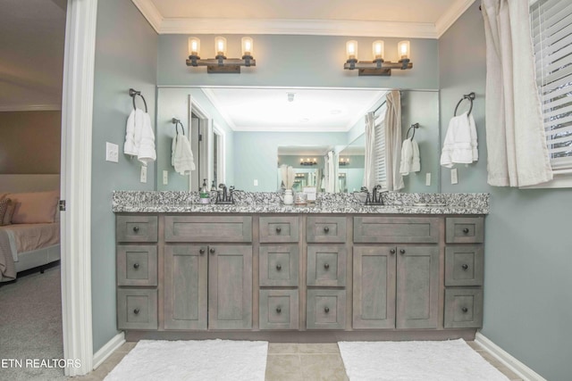 bathroom featuring ornamental molding and vanity