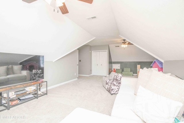 carpeted bedroom featuring lofted ceiling, a closet, and ceiling fan