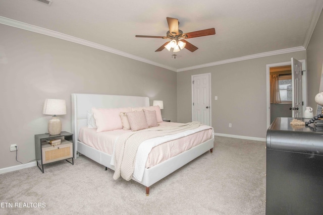 carpeted bedroom featuring ornamental molding and ceiling fan