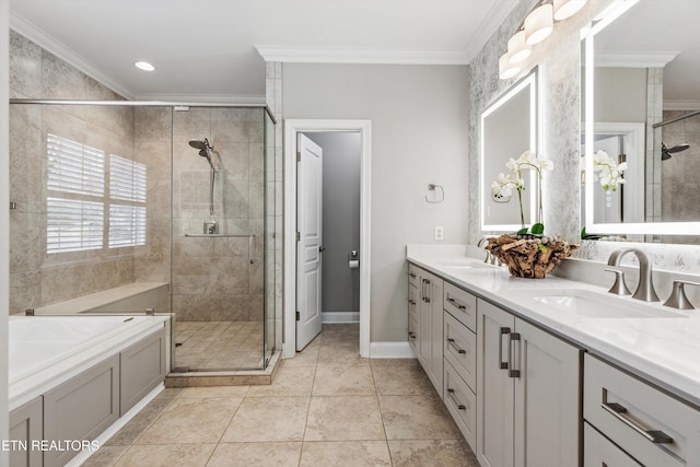 bathroom featuring tile patterned floors, ornamental molding, separate shower and tub, and vanity