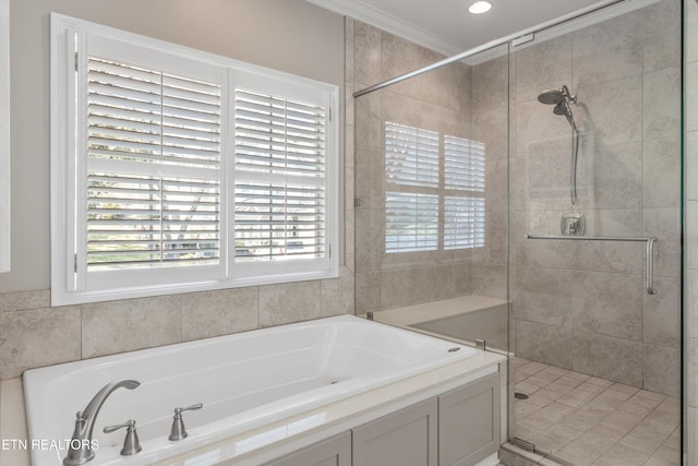 bathroom featuring crown molding and shower with separate bathtub