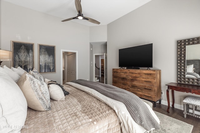 bedroom with wood-type flooring, vaulted ceiling, and ceiling fan