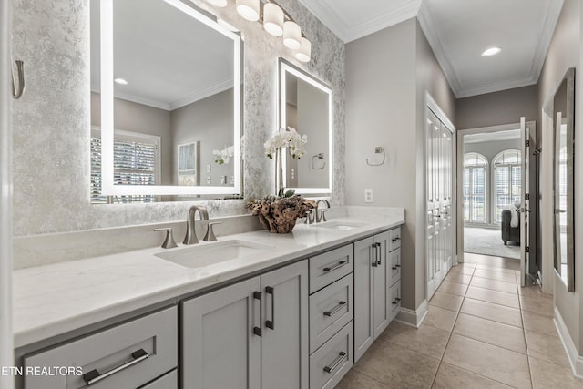 bathroom featuring ornamental molding, vanity, and tile patterned floors