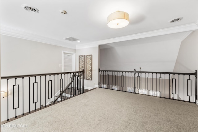 hallway featuring crown molding and carpet flooring