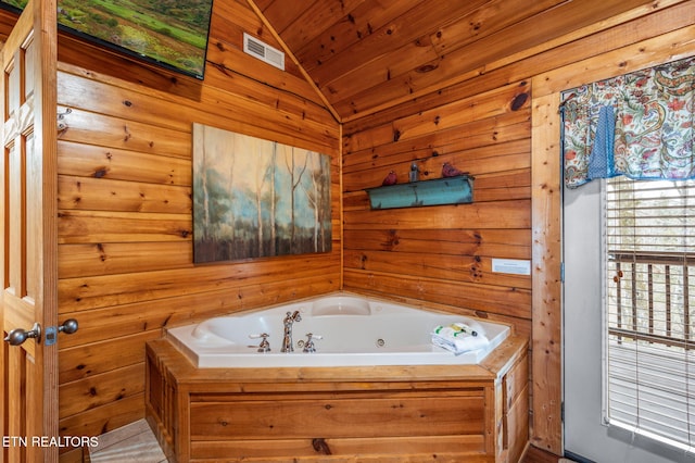 bathroom featuring wooden ceiling, vaulted ceiling, and a washtub