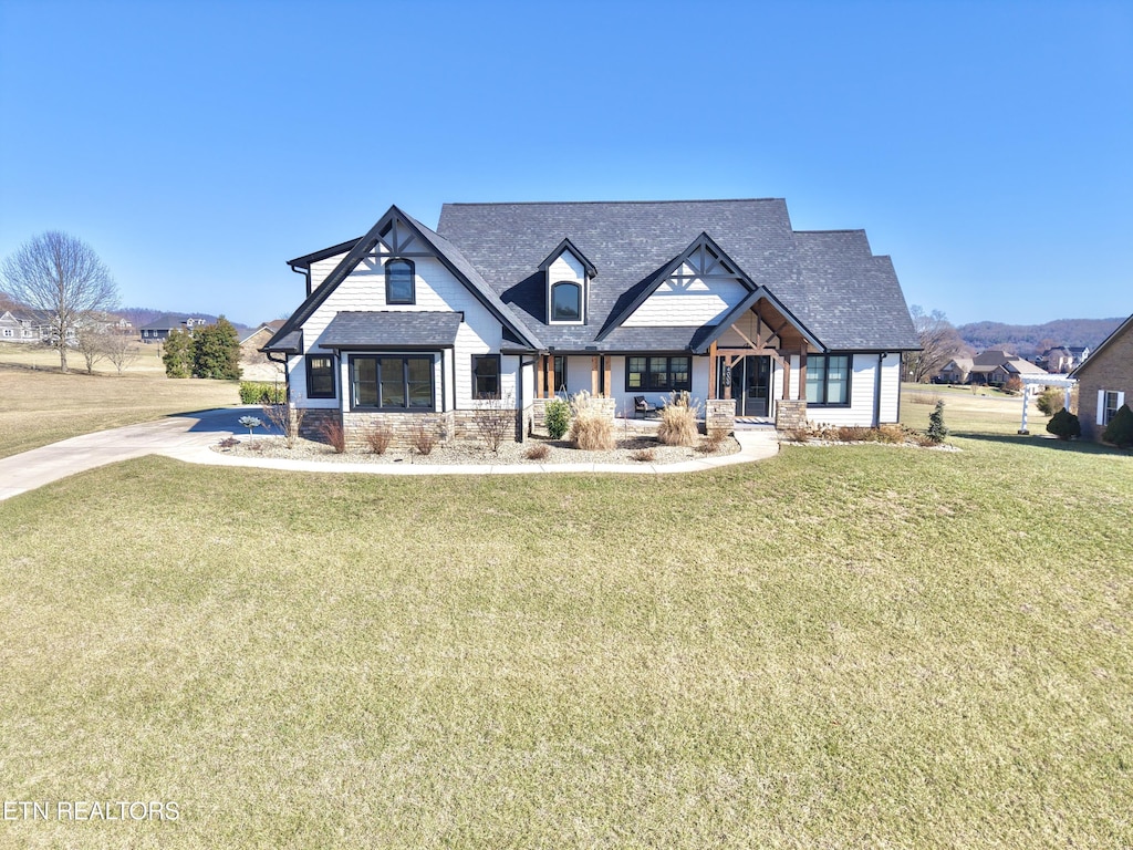 craftsman-style house with a front yard