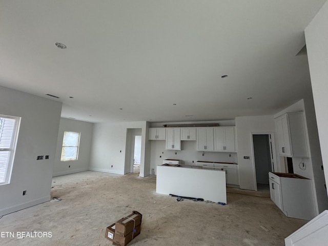 kitchen featuring a center island and white cabinets