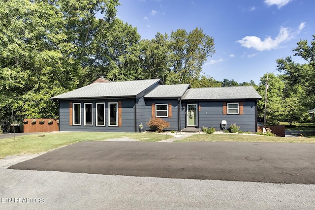 ranch-style house with a front lawn