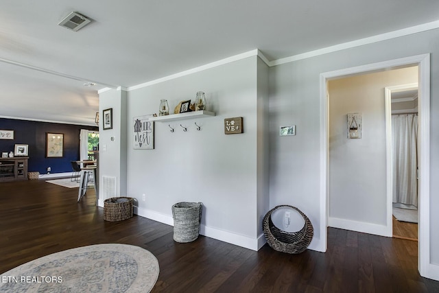 hallway featuring crown molding and dark hardwood / wood-style flooring